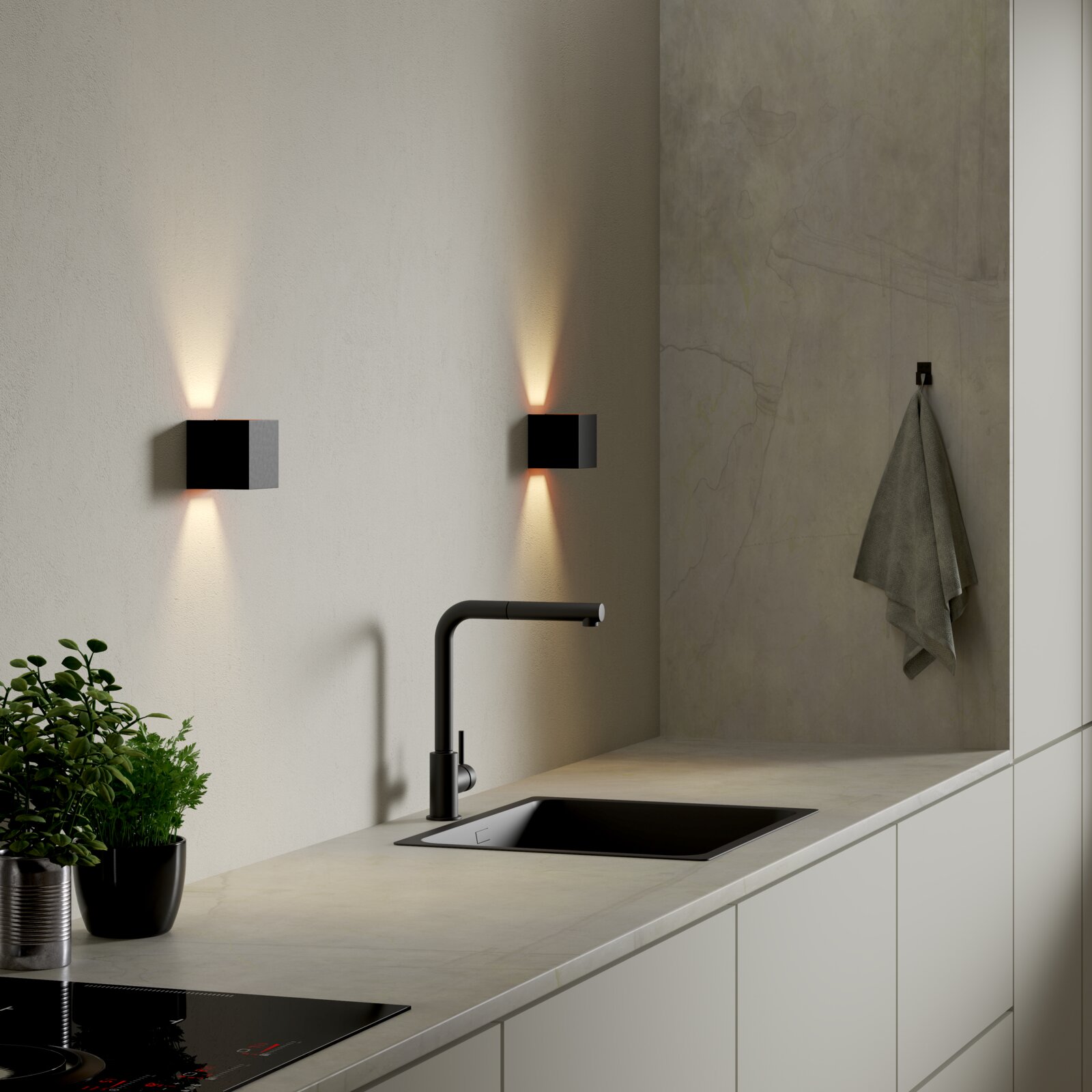 Moderne kubische LED-Wandleuchte in Schwarz mit Up-&-Down-Light an heller Küchenwand über Spüle, perspektivisch in leichter Seitenansicht