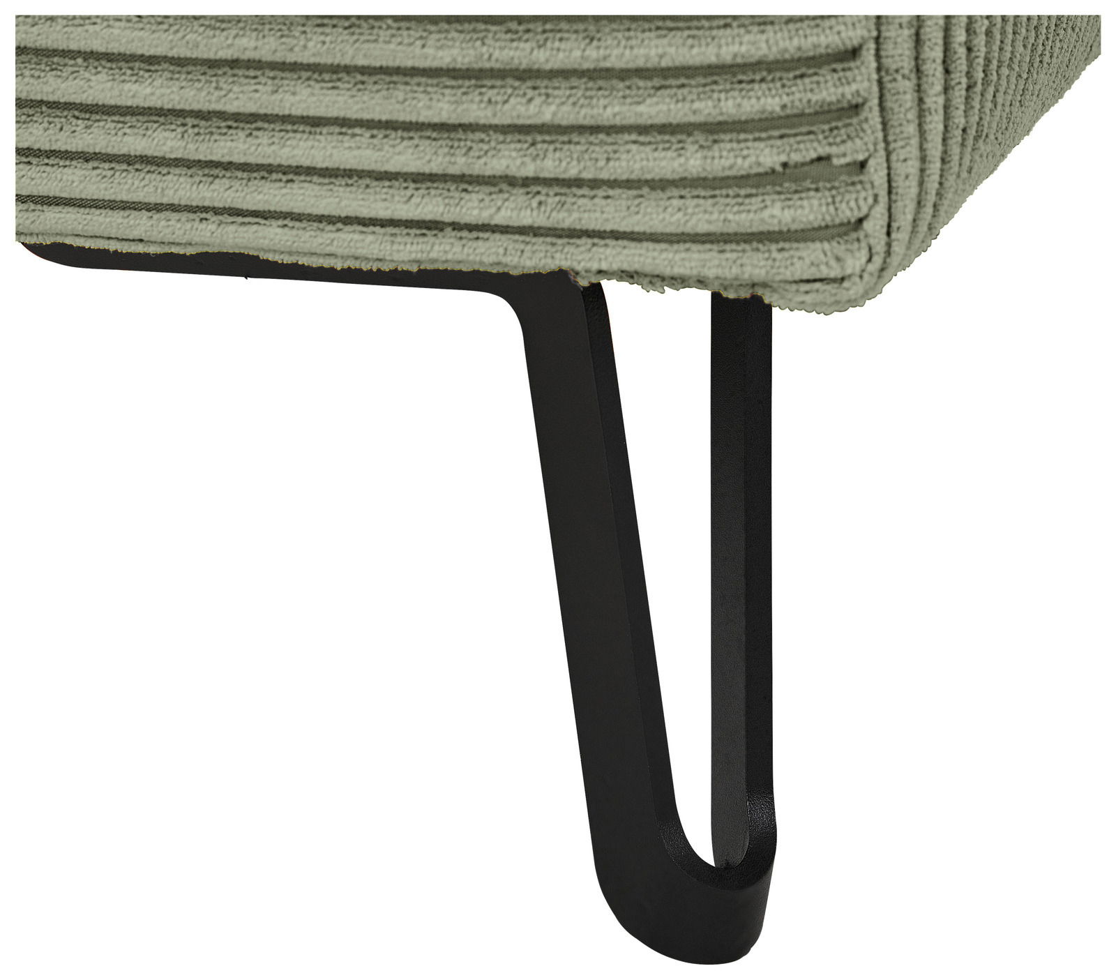 Nahaufnahme eines grünen, gerippten Stoffes mit einem schwarzen Metallbein, perspektivisch von der Seite aufgenommen.