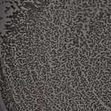 Nahaufnahme einer Oberfläche mit schwarzem und grauem, gesprenkeltem Muster.