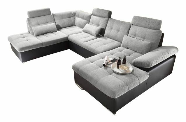 Graue U-förmige Rundecke mit verstellbaren Kopfstützen und Armlehnen, aus der Vogelperspektive fotografiert.