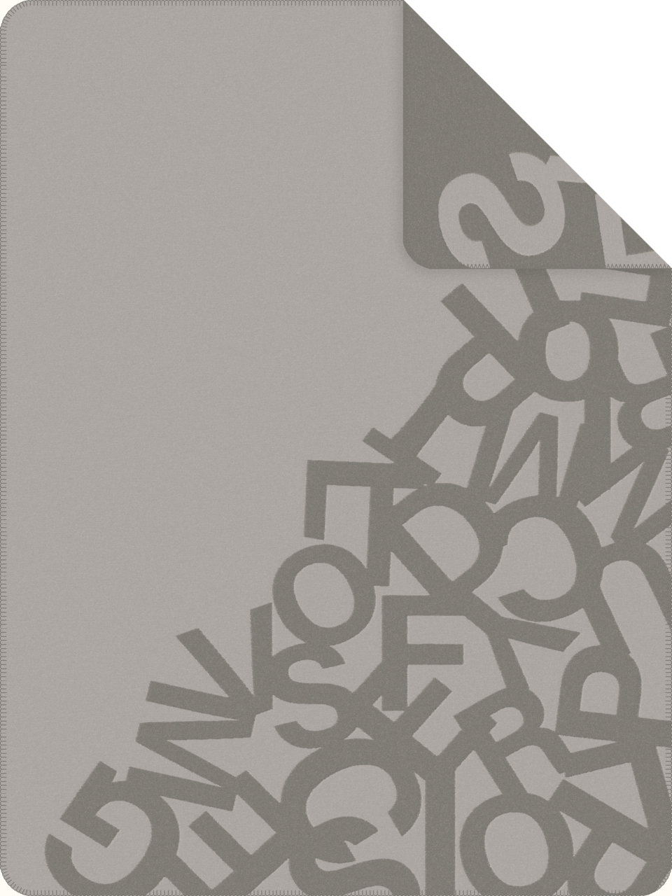 Graue Jacquard Decke mit Buchstabenmuster, Draufsicht