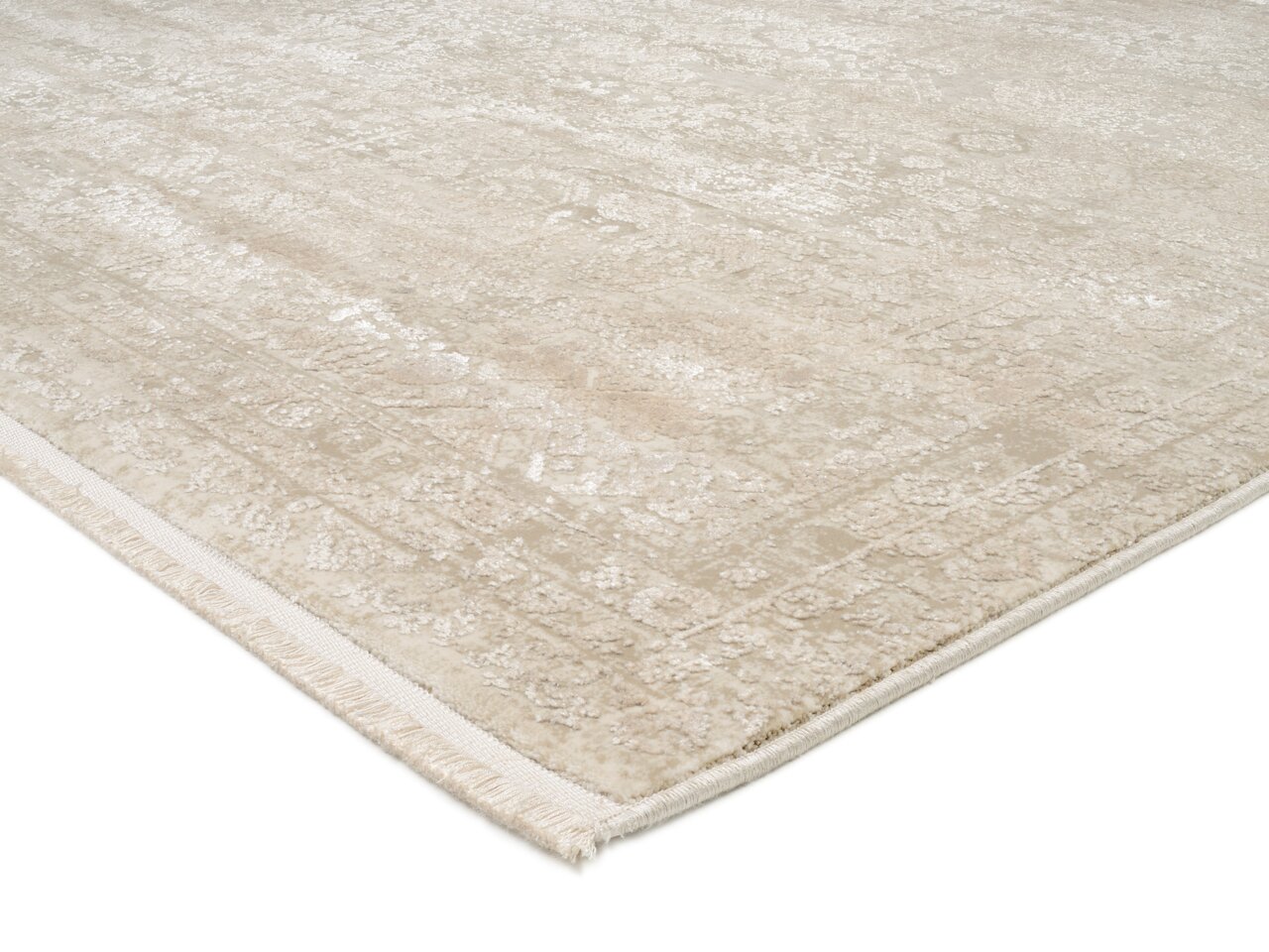Beiger Designer Teppich mit subtilen Mustern, perspektivisch von der Seite fotografiert.