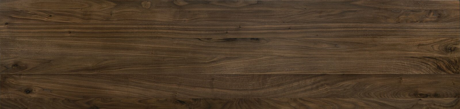 Draufsicht auf eine Holzoberfläche mit natürlicher Maserung, verwendet für ein Bettgestell.