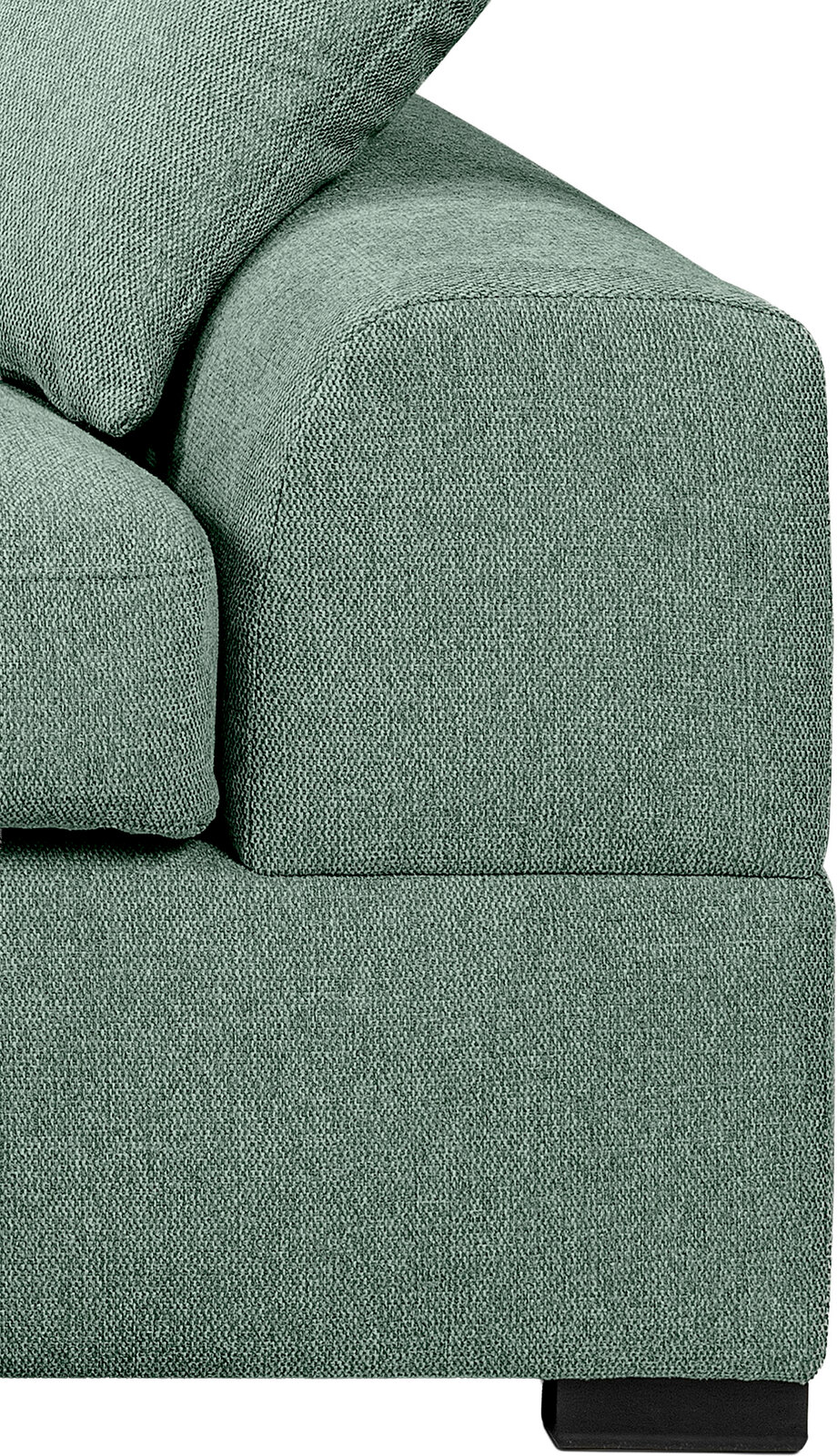 Detailaufnahme eines grünen Stoffsofas mit Armlehne und Kissen, seitliche Perspektive