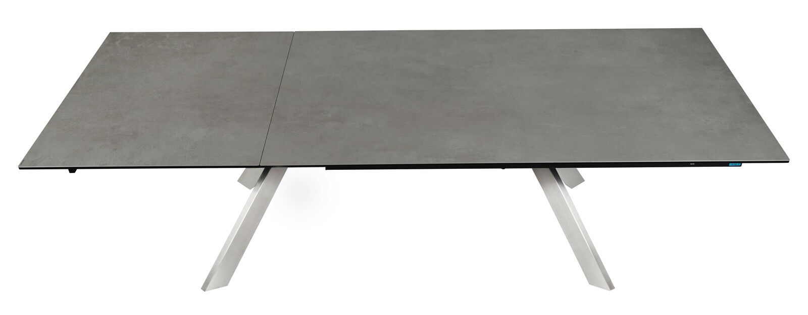 Moderner Esstisch mit grauer Tischplatte und schrägen Metallbeinen, Ansicht von oben.