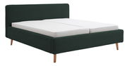 Polsterbettgestell in dunklem Grün mit Holzfüßen, seitliche Perspektive