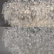 Close-up van een schitterende kroonluchter met talrijke kristallen, die in een elegant ontwerp zijn gerangschikt. Het perspectief toont de kroonluchter van onderaf, waardoor de lichtreflecties van de kristallen extra goed tot hun recht komen.