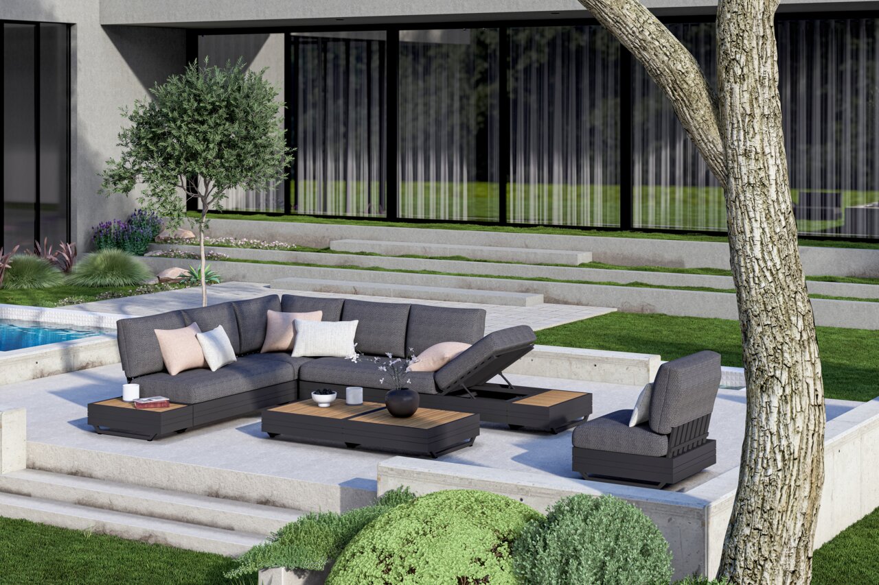 Moderne buitenlounge met grijze zitmeubelen en salontafels op een terras, omgeven door een groen landschap. Aanzicht van schuin bovenaf.