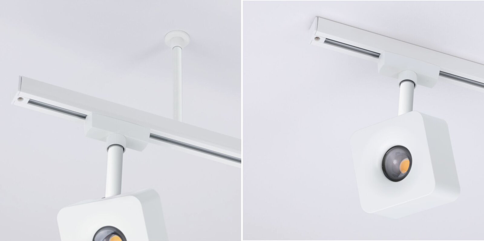 Weiße LED-Schienenleuchte/Spot mit quadratischem Leuchtenkopf an Deckenstromschiene, aus leicht schräger Untersicht fotografiert