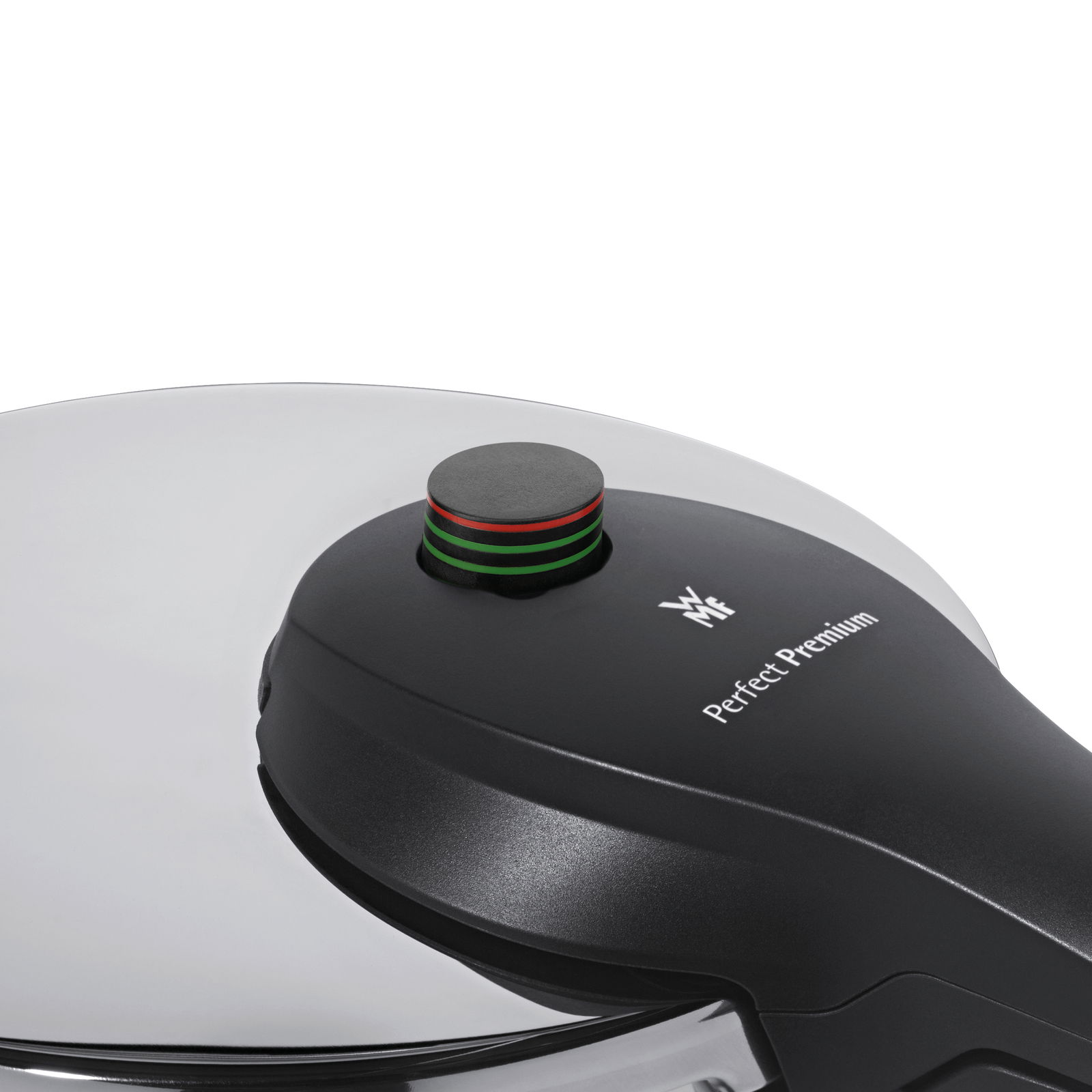Nahaufnahme eines Schnellkochtopfdeckels der Marke WMF, Modell Perfect Premium, mit Druckanzeige in Schwarz, Rot und Grün.