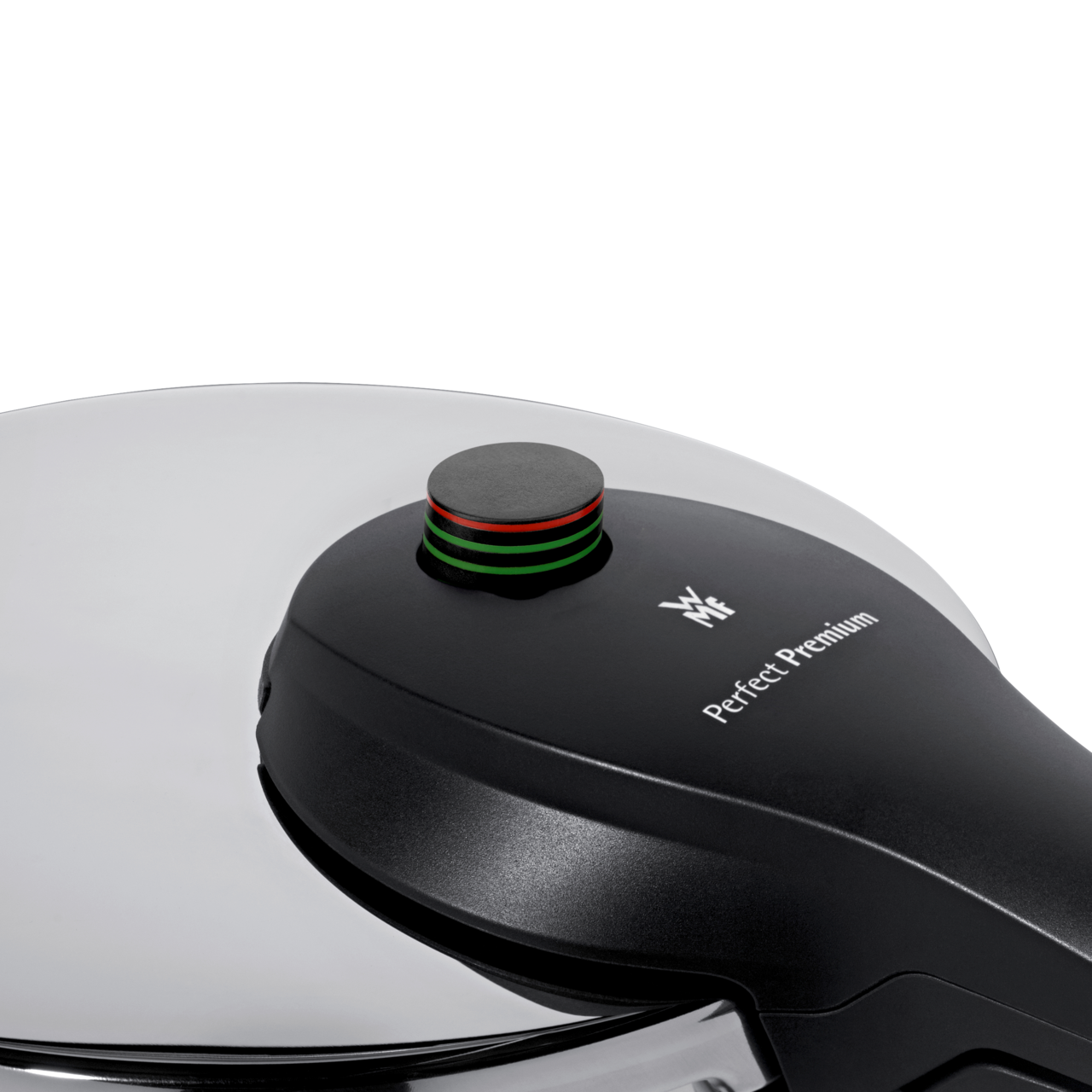 Nahaufnahme eines Schnellkochtopfdeckels der Marke WMF, Modell Perfect Premium, mit Druckanzeige in Schwarz, Rot und Grün.