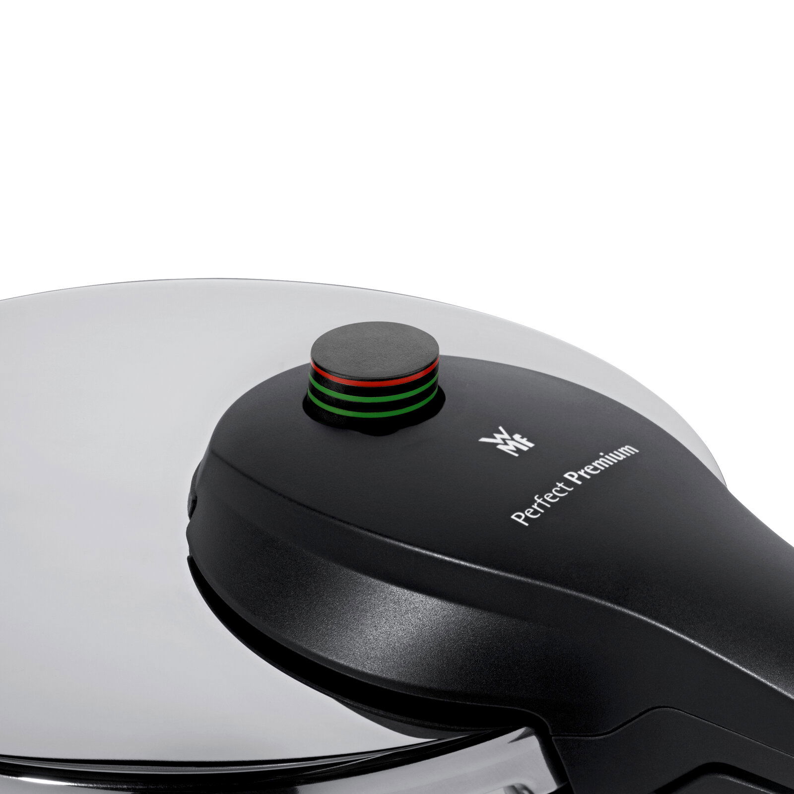 Nahaufnahme eines Schnellkochtopfdeckels der Marke WMF, Modell Perfect Premium, mit Druckanzeige in Schwarz, Rot und Grün.