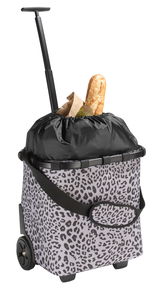 Einkaufstrolley mit Leopardenmuster, gefüllt mit Lebensmitteln, seitliche Perspektive