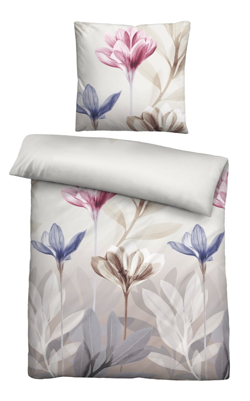 Bettwäsche-Set mit floralem Design in sanften Farben, bestehend aus einem Kissenbezug und einem Deckenbezug, aus der Vogelperspektive fotografiert.