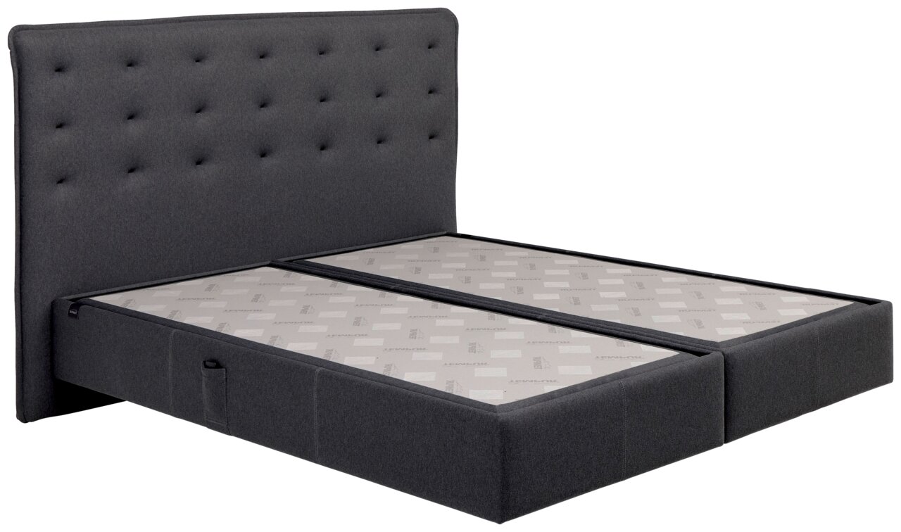 Boxspringbett mit grauem, gestepptem Kopfteil, seitliche Perspektive
