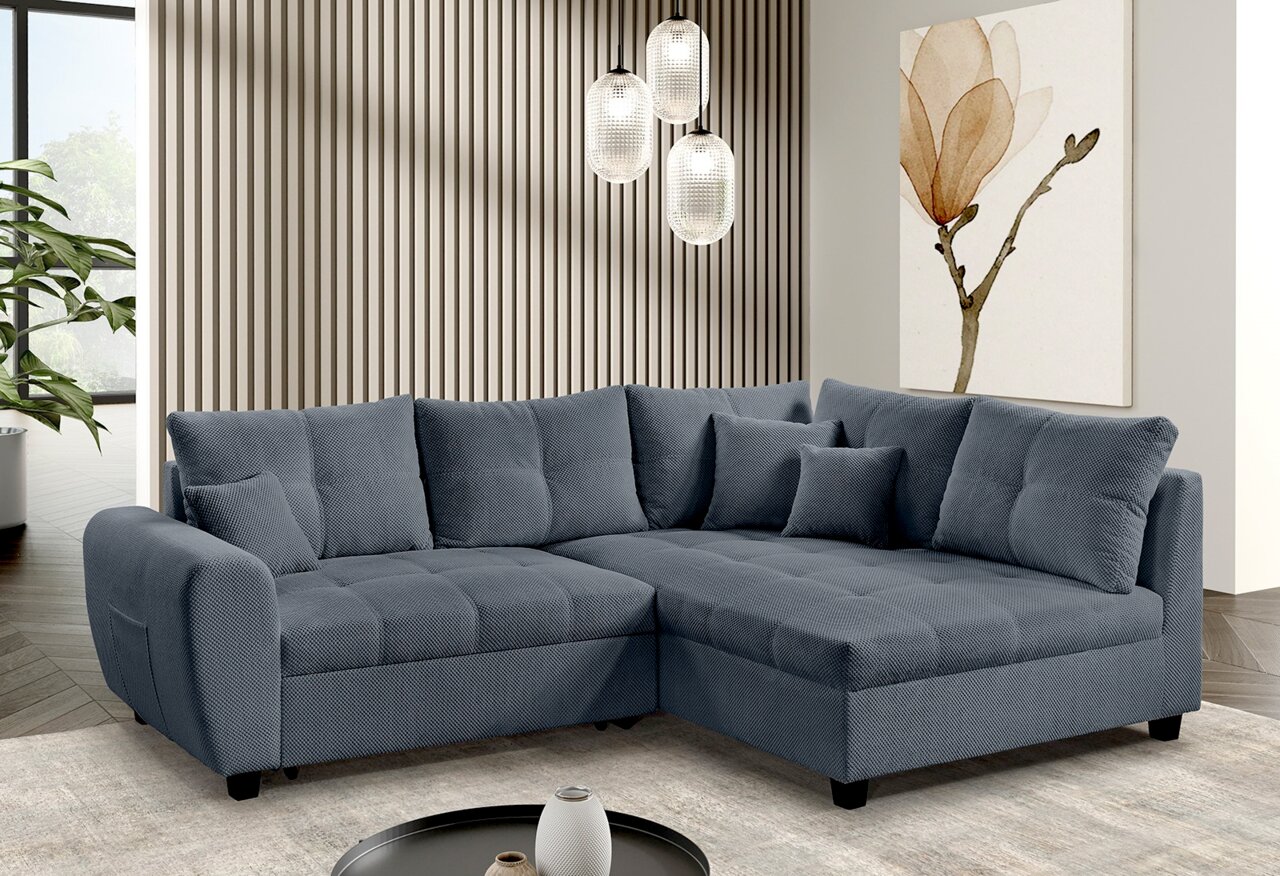Graue Rundecke (L) in einem modernen Wohnzimmer, seitliche Perspektive.
