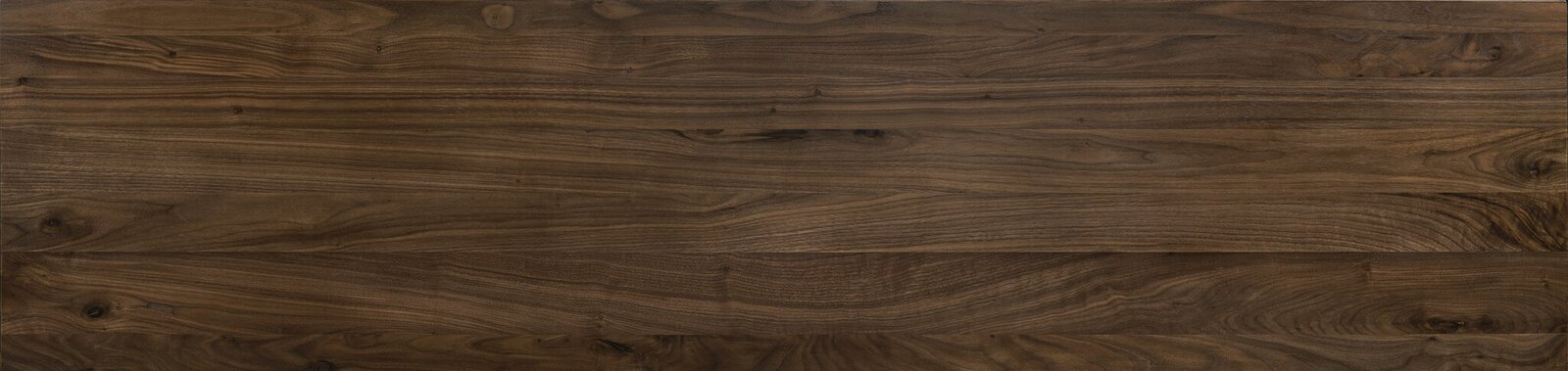 Draufsicht auf eine Holzoberfläche mit natürlicher Maserung, verwendet für ein Bettgestell.