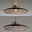 Moderne Pendelleuchte PURE Moon in seitlicher Perspektive mit elegantem, flachem Schirm und warmem Licht.