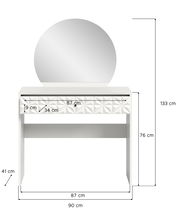 Weißer Schminktisch mit rundem Spiegel, geometrischem Muster auf der Schublade, frontal abgebildet.