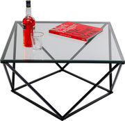 Moderner Beistelltisch mit Glasplatte und geometrischem Metallgestell, von oben fotografiert. Auf dem Tisch stehen eine Flasche, ein Glas und ein Buch.