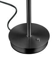 Nahaufnahme der Basis einer LED-Tischleuchte in schwarzem Metall mit einem Kabel und einem Schalter.