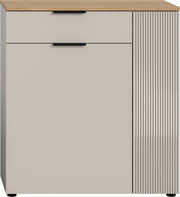 Moderne Kommode mit einer Schublade und einer Tür, Frontansicht, mit Holzoberfläche und geriffeltem Design auf der rechten Seite.