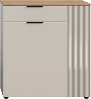 Moderne Kommode mit einer Schublade und einer Tür, Frontansicht, mit Holzoberfläche und geriffeltem Design auf der rechten Seite.