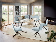 Moderne Eckbank 163x203 cm in einem hellen Raum mit großen Fenstern, umgeben von stilvollen Stühlen und einem Holztisch, aus der Perspektive des Wohnzimmers betrachtet.