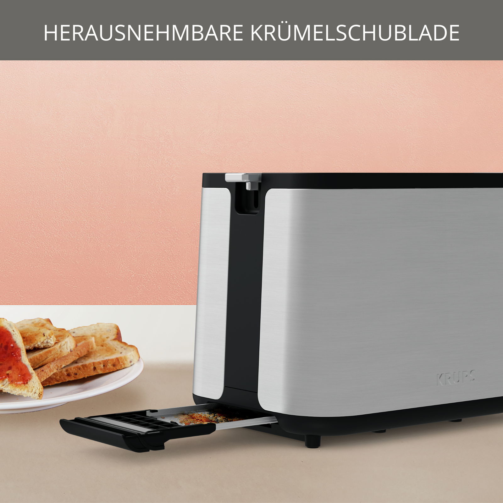 Toaster mit herausnehmbarer Krümelschublade, seitliche Perspektive, mit Toast auf einem Teller im Hintergrund.