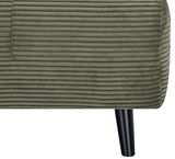 Nahaufnahme eines grünen Funktionssessels mit geripptem Stoffbezug und schwarzem Bein, seitliche Perspektive.