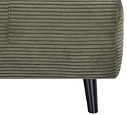 Nahaufnahme eines grünen Funktionssessels mit geripptem Stoffbezug und schwarzem Bein, seitliche Perspektive.