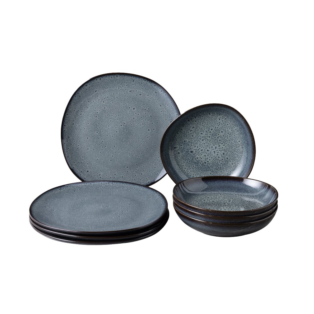 Tafelservice 8-tlg. in dunklem Blau mit gesprenkeltem Design, bestehend aus flachen und tiefen Tellern, seitliche Perspektive