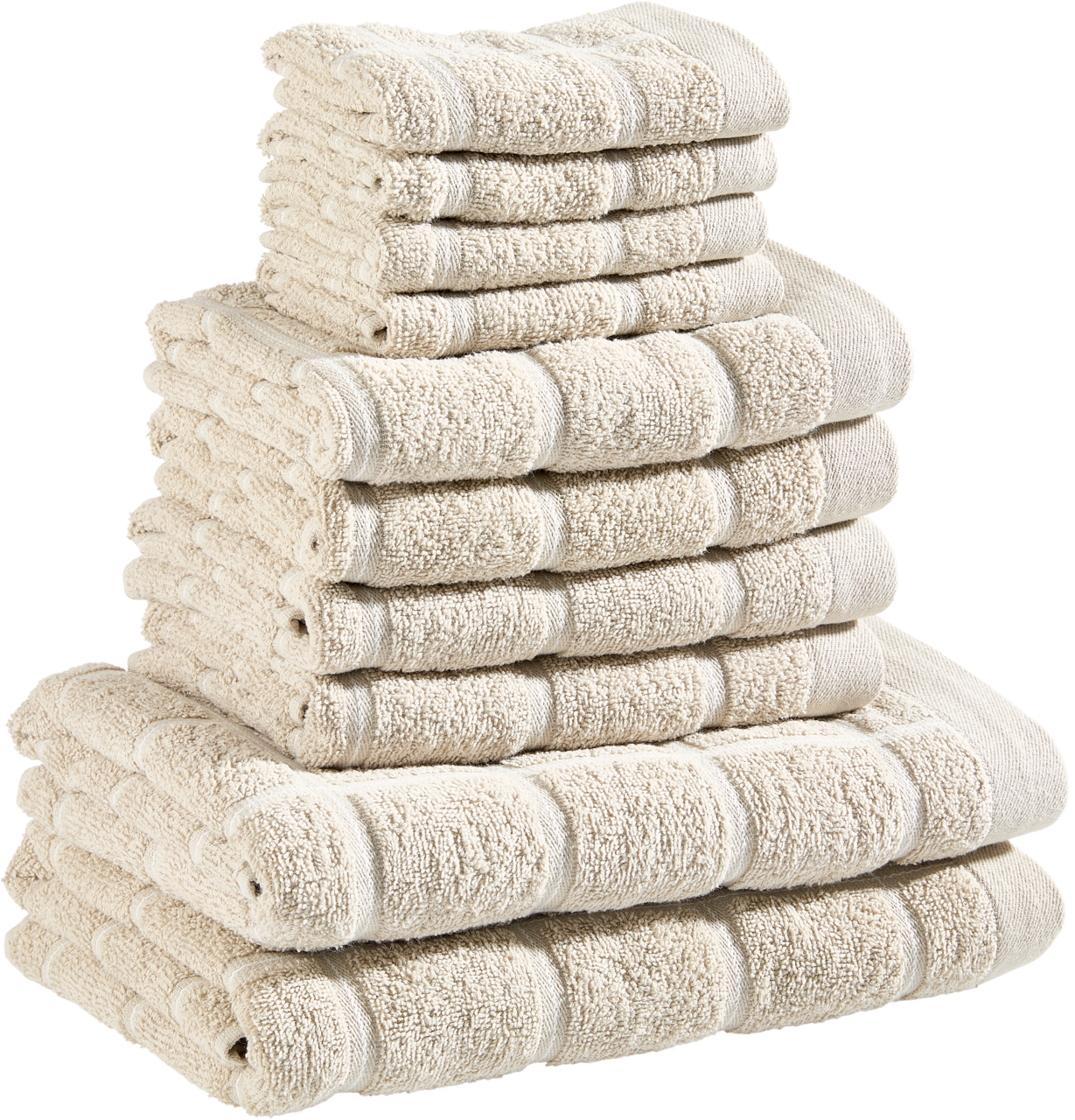 Ein Stapel beiger Frottierhandtücher in verschiedenen Größen, von der Seite betrachtet.