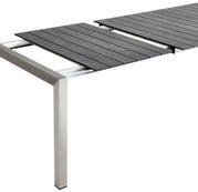 Moderne uitschuifbare tafel met donker tafelblad en metalen onderstel, zijaanzicht