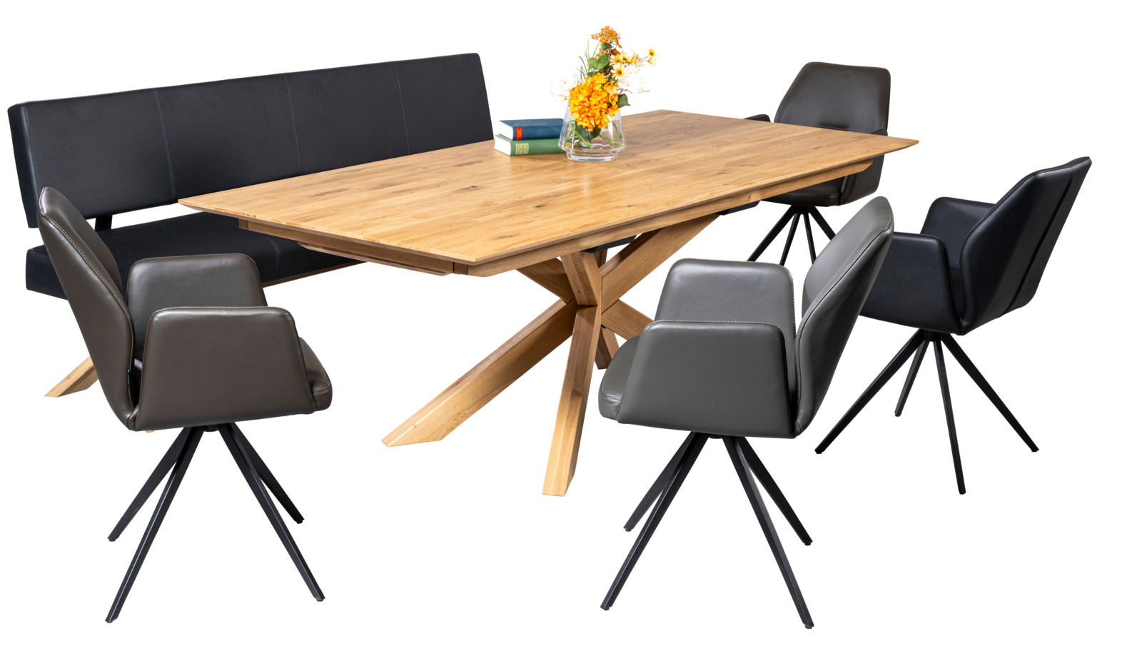 Moderner Esstisch aus Holz mit X-förmigem Gestell, umgeben von schwarzen Stühlen und einer Bank, seitliche Perspektive.