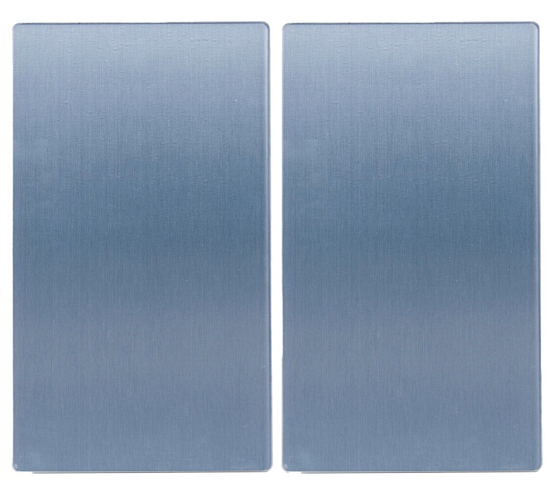 Zwei rechteckige Glasschneideplatten in blauer Farbe, nebeneinander liegend, aus der Vogelperspektive fotografiert.