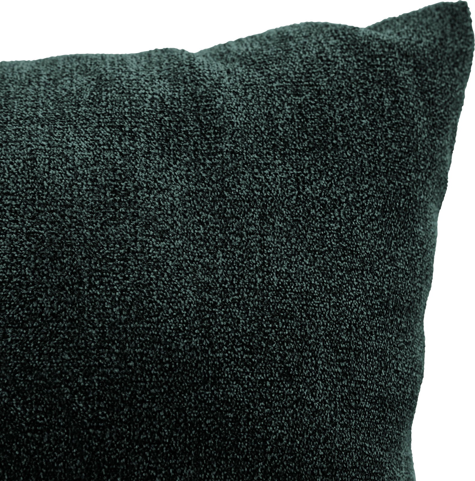 Nahaufnahme eines dunkelgrünen Kissens mit weicher Textur, perspektivisch von der Seite aufgenommen.