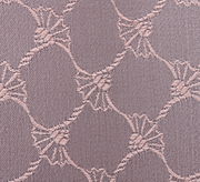 Nahaufnahme eines Stoffes mit einem eleganten, kreisförmigen Muster in Nude-Tönen.