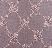 Nahaufnahme eines Stoffes mit einem eleganten, kreisförmigen Muster in Nude-Tönen.