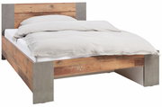 Bett aus Holz und Betonoptik, seitliche Perspektive