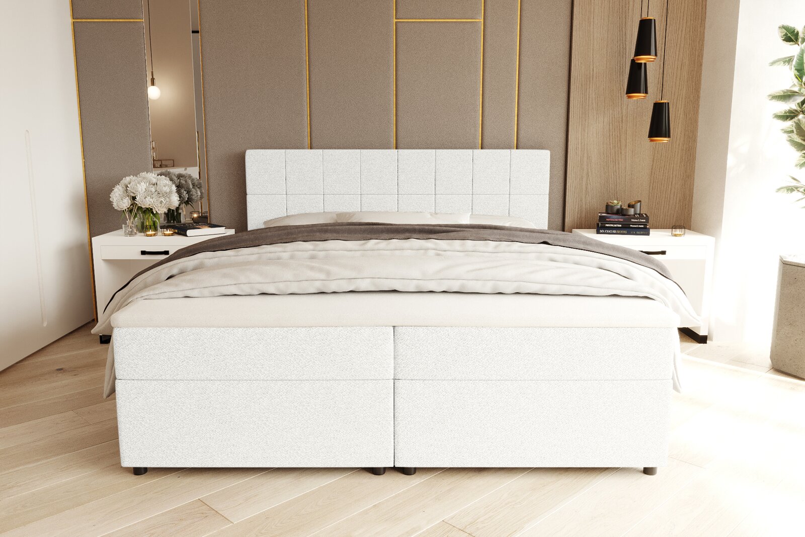 Modern wit boxspringbed met een gestoffeerd, vierkant doorgestikt hoofdeinde in een lichte slaapkamer, vooraanzicht vanuit een licht verhoogde positie aan de voorkant.