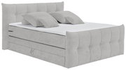 Boxspringbett in seitlicher Perspektive mit gepolstertem Kopf- und Fußteil, inklusive zwei Kissen.