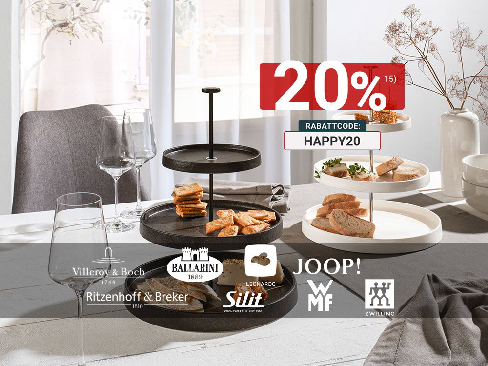 Moderne schwarze und weiße Etagèren mit stilvoll arrangierten Snacks und Gläsern auf hellem Esstisch.