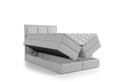 Lichtgrijs gestoffeerd tweepersoons boxspringbed met hoge verstelbare matrassen en open opbergruimte, schuin van voren weergegeven.