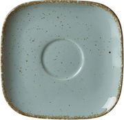 Vogelperspektive auf eine quadratische, blaue Untertasse mit gesprenkeltem Design und rustikalem Rand.