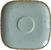 Vogelperspektive auf eine quadratische, blaue Untertasse mit gesprenkeltem Design und rustikalem Rand.