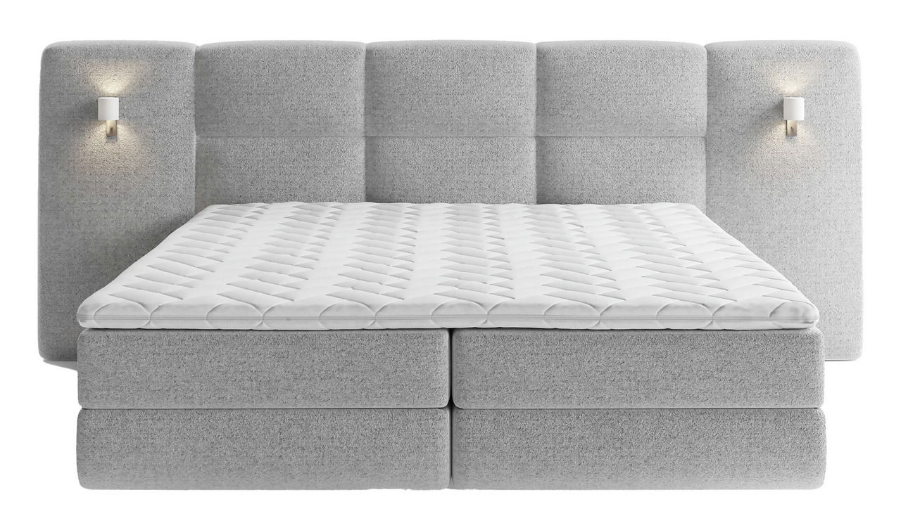 Frontale Ansicht eines grauen Boxspringbetts mit gepolstertem Kopfteil und integrierten Wandlampen.