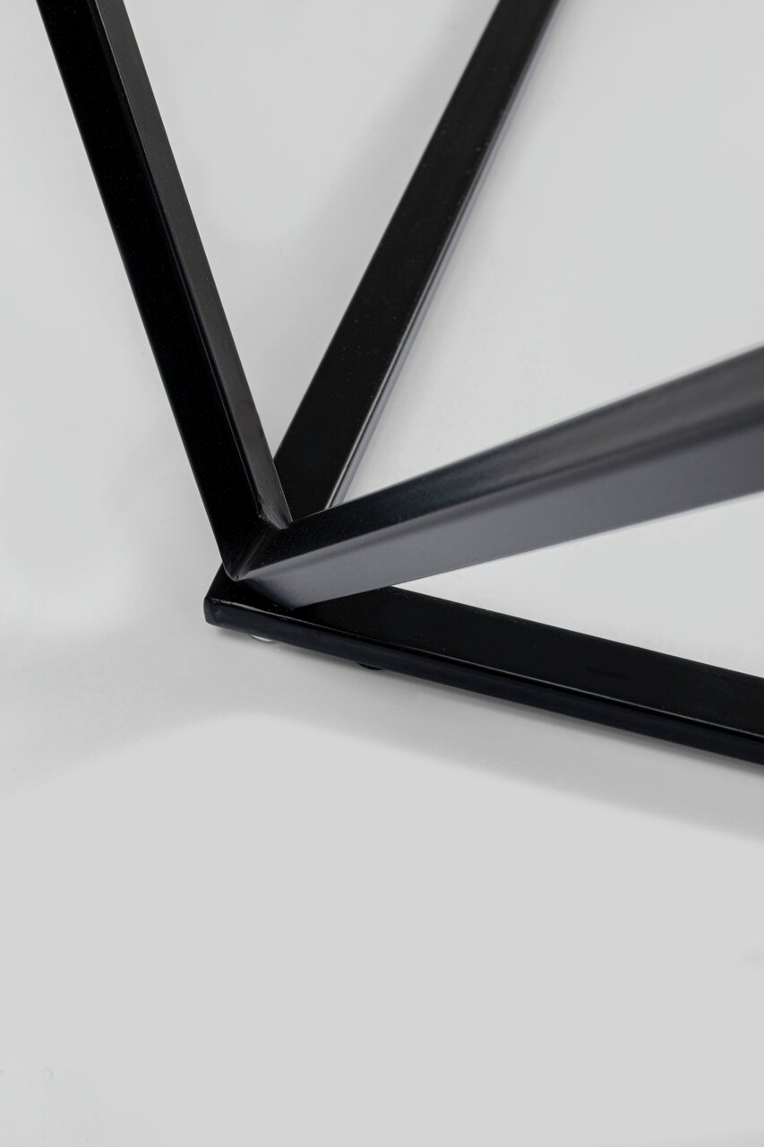 Nahaufnahme eines schwarzen Metallgestells eines Beistelltisches aus der Vogelperspektive.