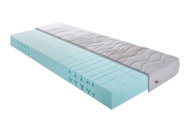 Kaltschaummatratze H3 140x200 in seitlicher Perspektive mit sichtbarem Schaumstoffkern und abnehmbarem Bezug