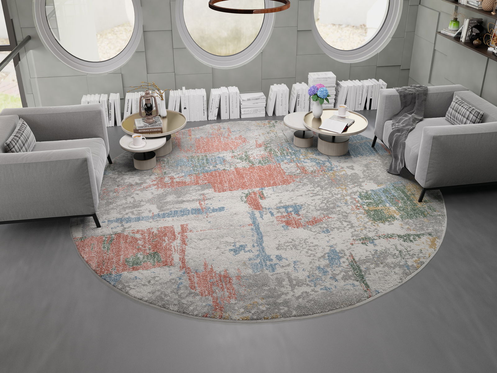 OCI Frisé-tapijt NEW VILLA Runder Frisé-Teppich mit buntem, abstraktem Muster in einem modernen Wohnzimmer mit grauen Sofas und runden Tischen, aus der Vogelperspektive betrachtet.